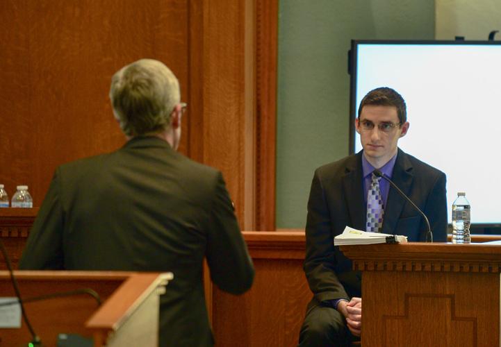 Prosecuting Attorney Dan Knight, left, questions Joseph Elledge during the trial