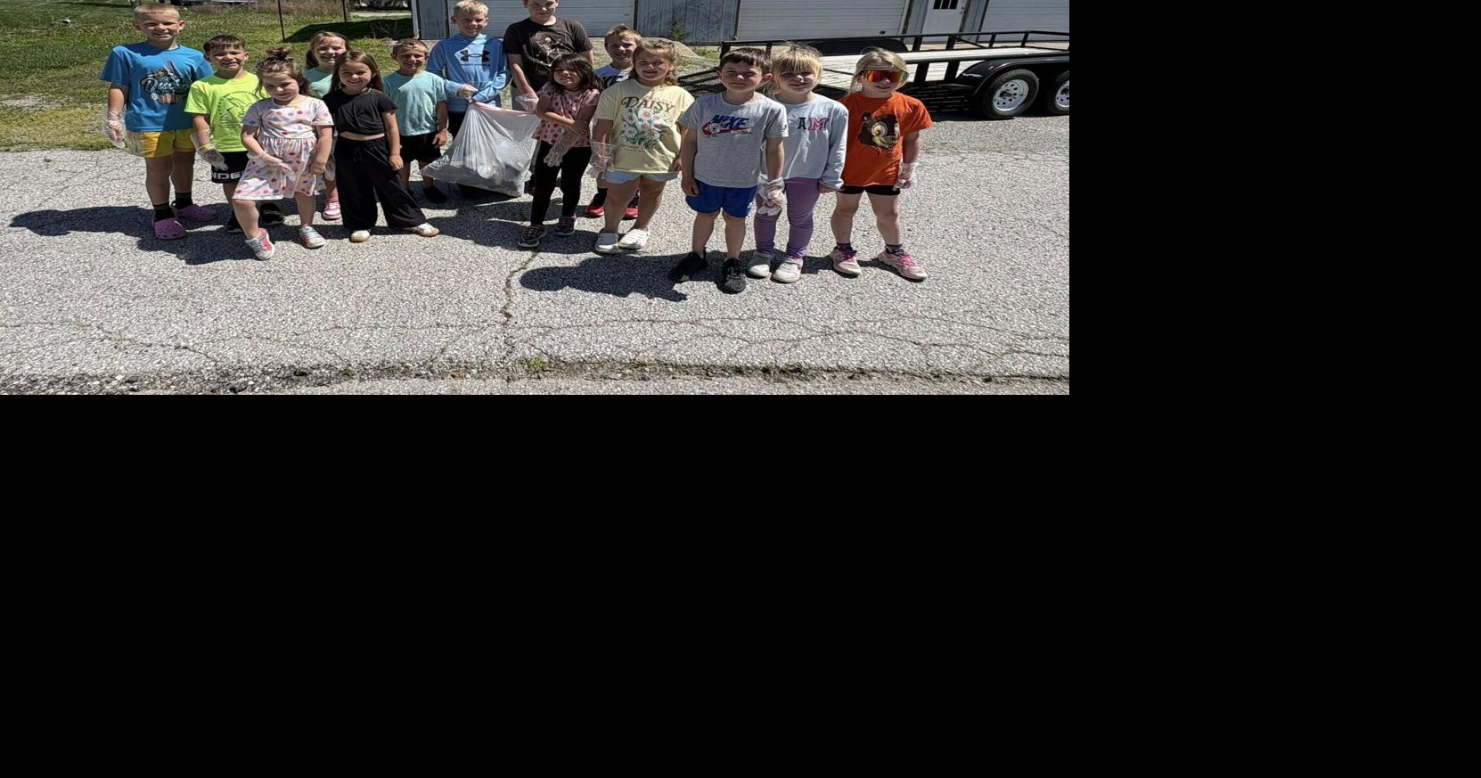 Kids at Eagle Achievers pick up trash for Earth Day