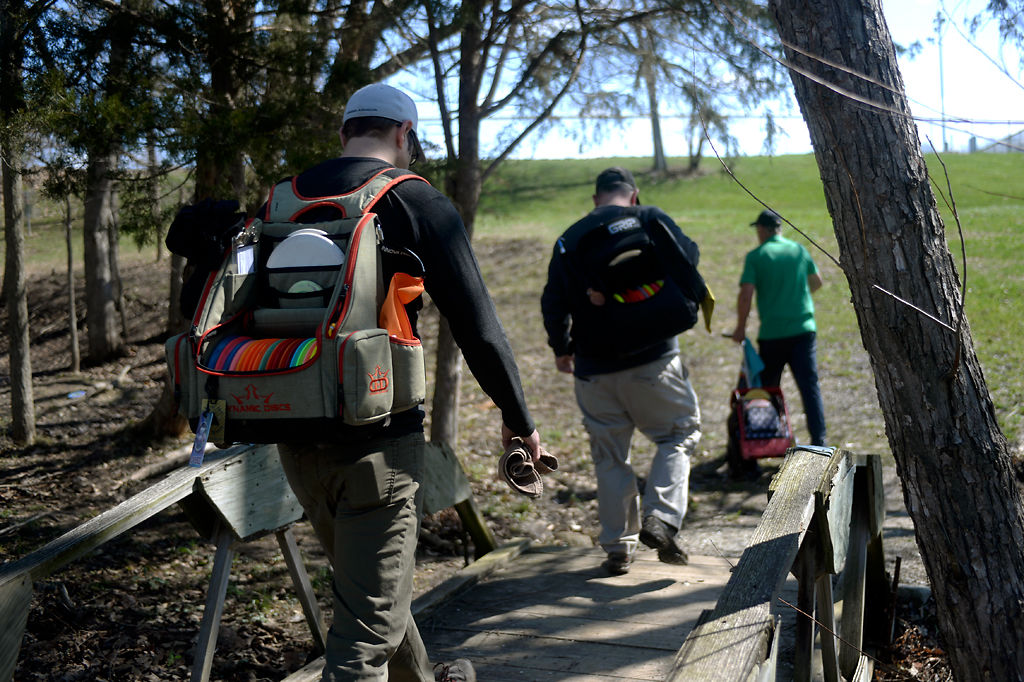 From left, Joel Amundson, Corey Chaney and Sparky Zumwalt walk towards the second hole