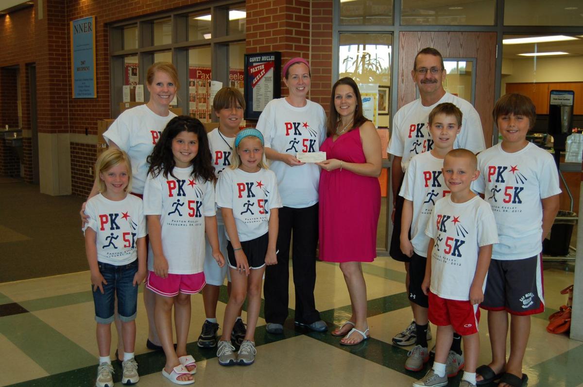 FROM READERS Paxton Keeley 5K organizers, participants present check