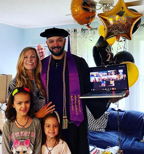 University of Missouri School of Law graduate Don Quinn celebrates his graduation with family over Zoom