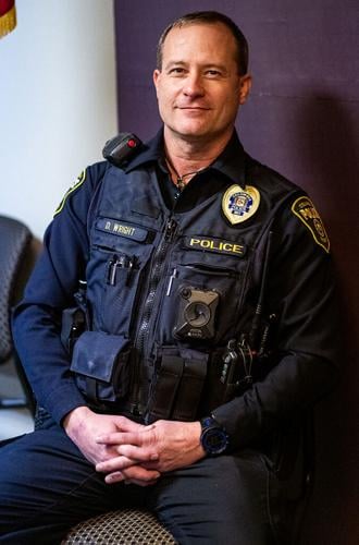 Officer Dan Wright sits for a portrait