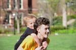 Caden Rushing, 15, gives Felix Rushing, 3, a piggyback ride