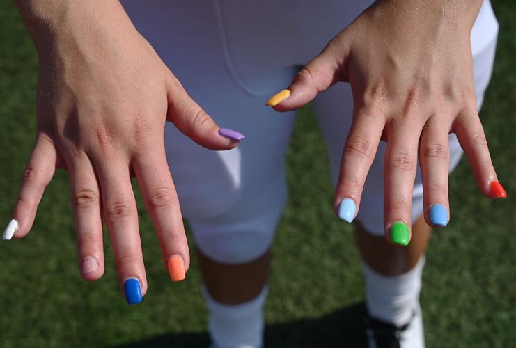 Sam Schupp shows off her painted nails