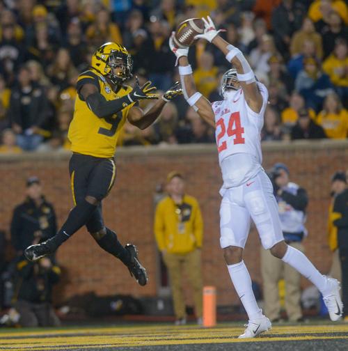 Old Miss defensive back DeAntre Prince goes to intercept the ball from Missouri wide receiver Jalen Knox