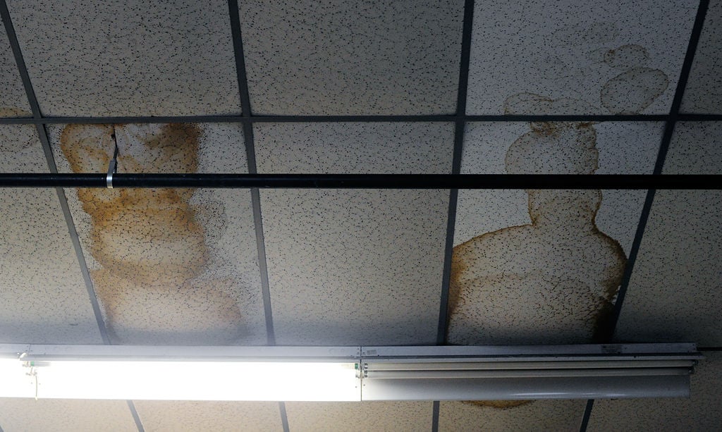 Water Stains Mark The Ceiling Tiles In A Garage Photos