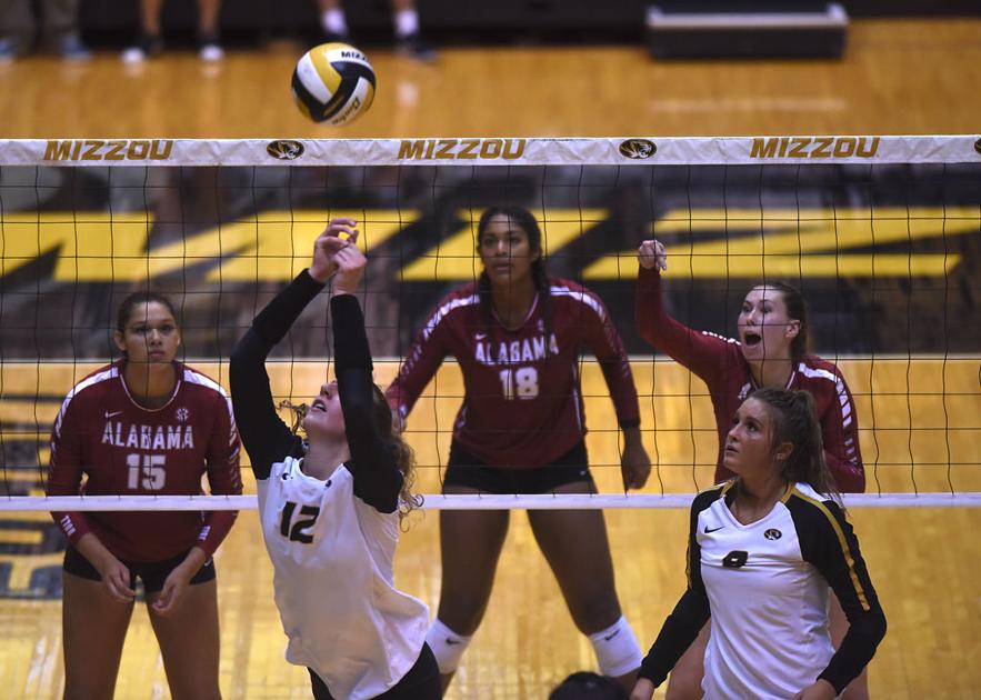 Missouri volleyball player Kylie Deberg bumps the ball to a teammate