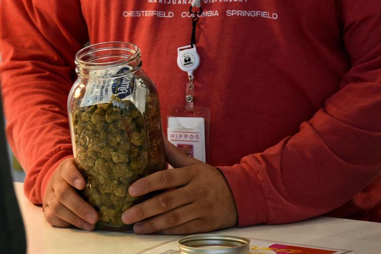 Lead budtender, Tyrel White sells Sundro flower on Tuesday, Feb. 6
