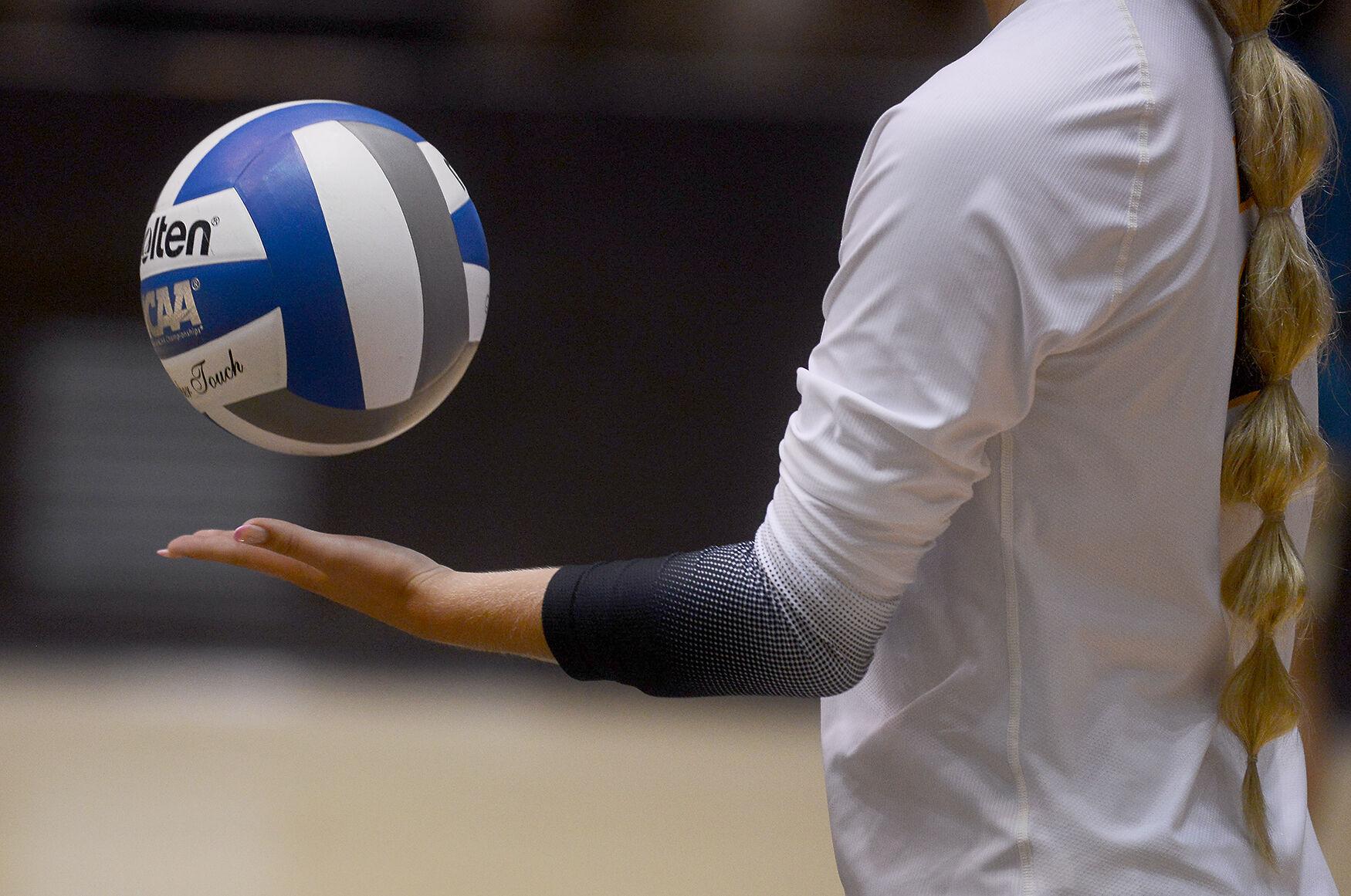 Freshman Estella Zatechka prepares to serve the ball Sports
