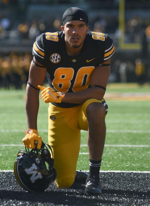 Messiah Swinson kneels in the end zone