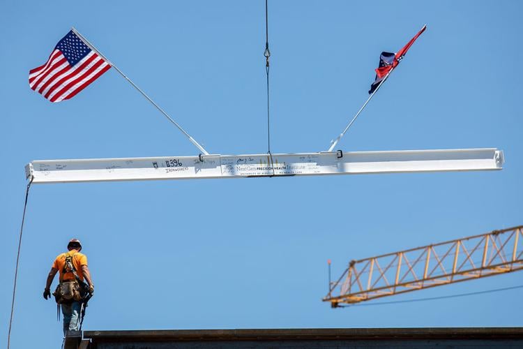 The I-beam is added to the NextGen Precision Health Institute building