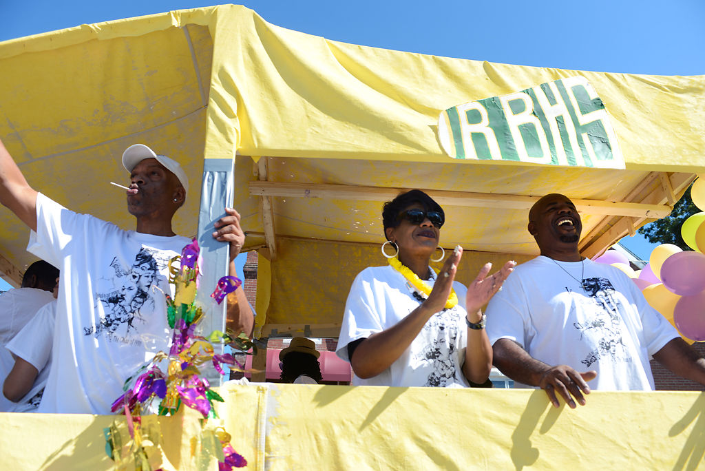 Pamela Hardin, center, and her husband, Martin Hardin, right, clap and smile