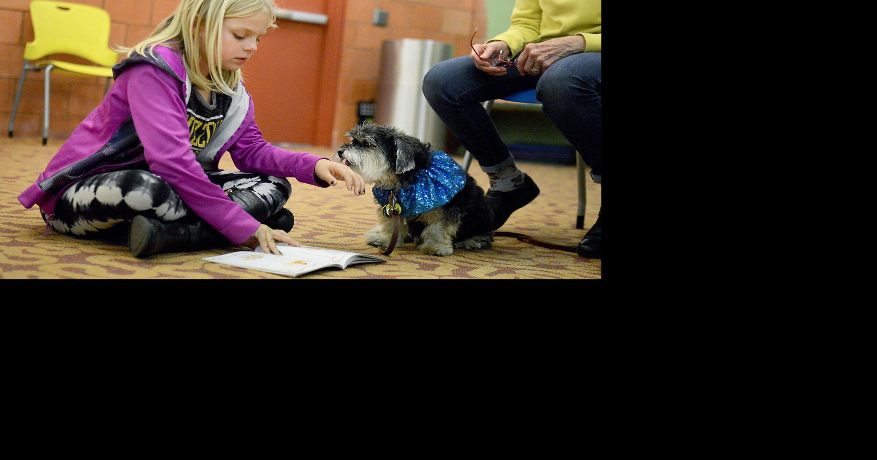 Kids read to therapy dogs at Columbia Public Library | Local ...