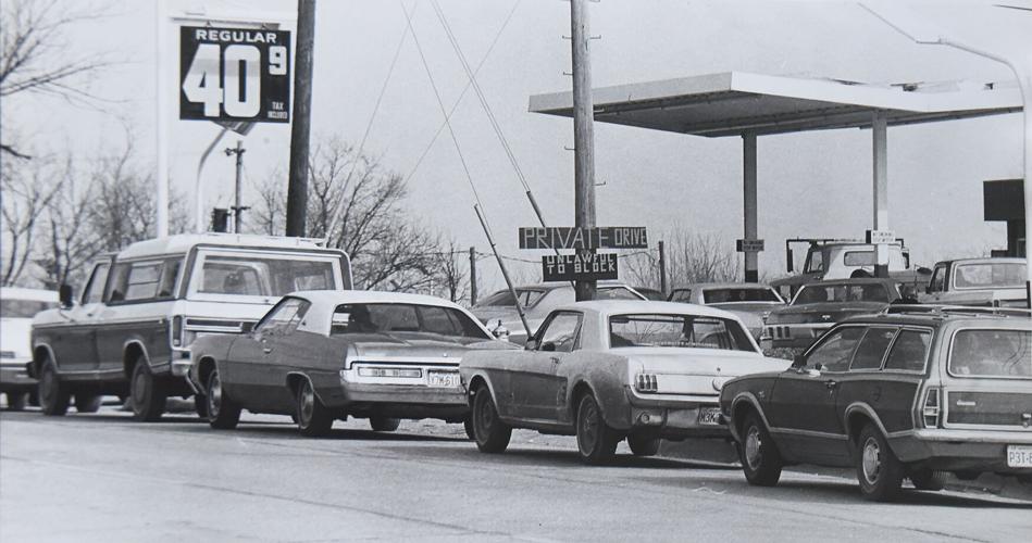 Cars line up outside a gas station