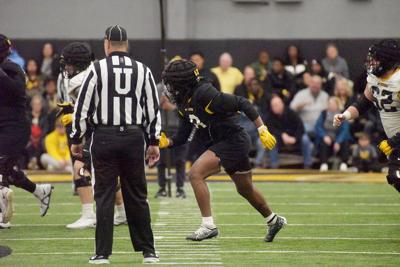 Linebacker Ty'Ron Hopper (8) runs a play during the spring game on Saturday