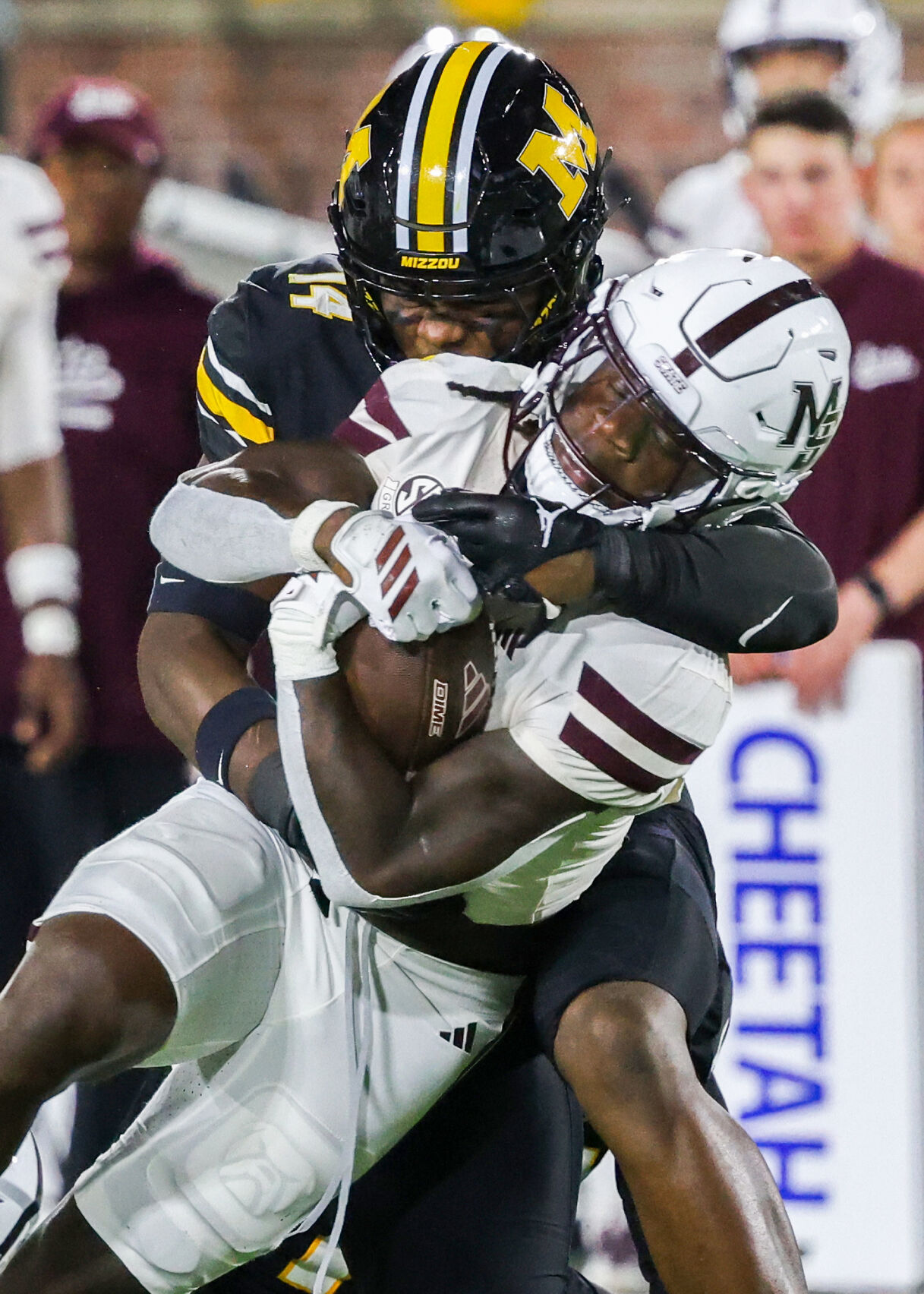 Linebacket Body Missouri linebacker Triston Newson (14) tackles Mississippi State ...