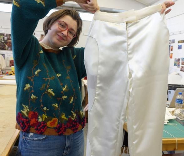 Kittle holds the final muslin of the satin pants