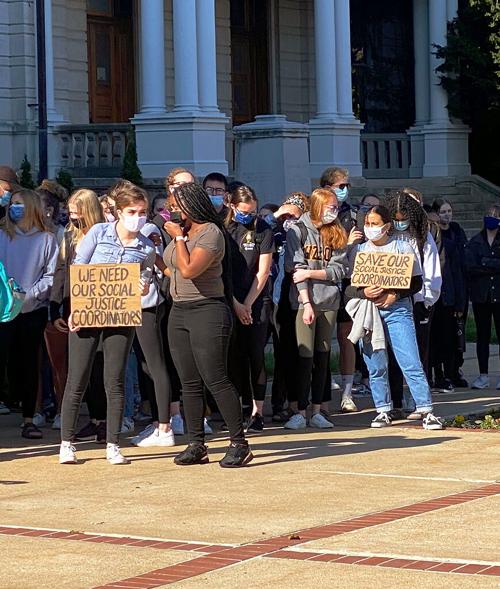 Protesters are gathered outside of Jesse Hall
