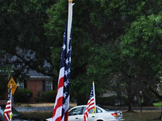 Members Of The Community Gather To Place Flags In Honor Of Spc Sterling Wyatt News Columbiamissourian Com