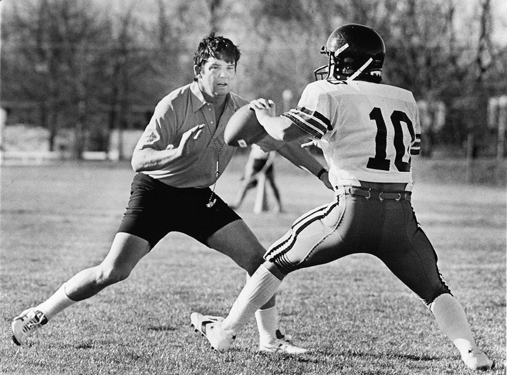 Archive photo of Warren Powers helping run a drill during a practice