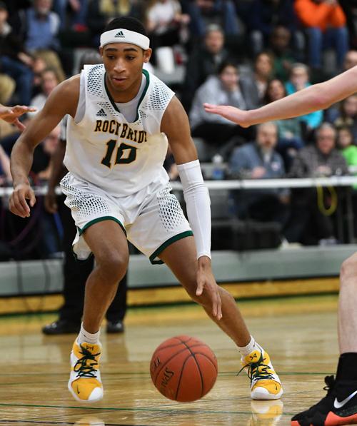 Rock Bridge Guard Dajuan Harris Dribbles Past A Jefferson City