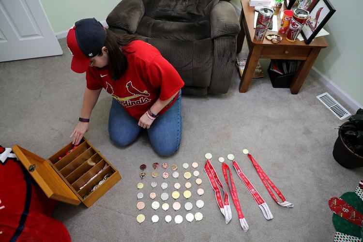 Tatia Leyden shows off her some of her 160 Special Olympic medals