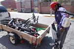 Cleo Willis helps unload bird scooters