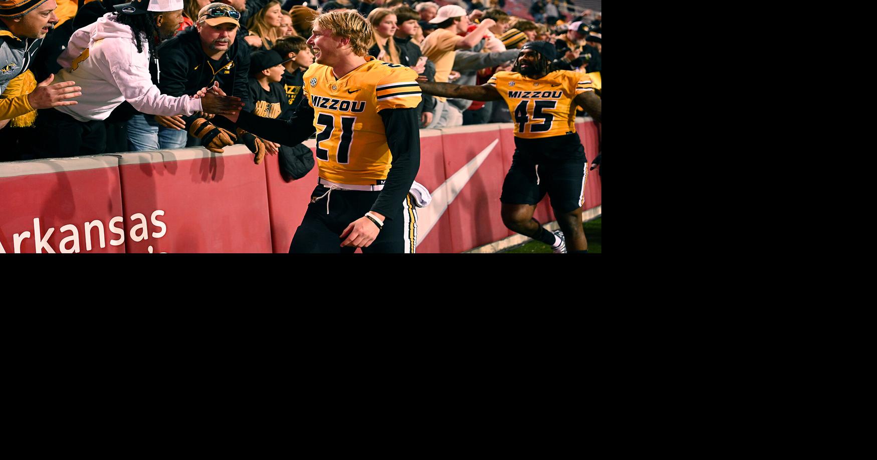 Mizzou quarterback Sam Horn celebrates with fans after a win Sports