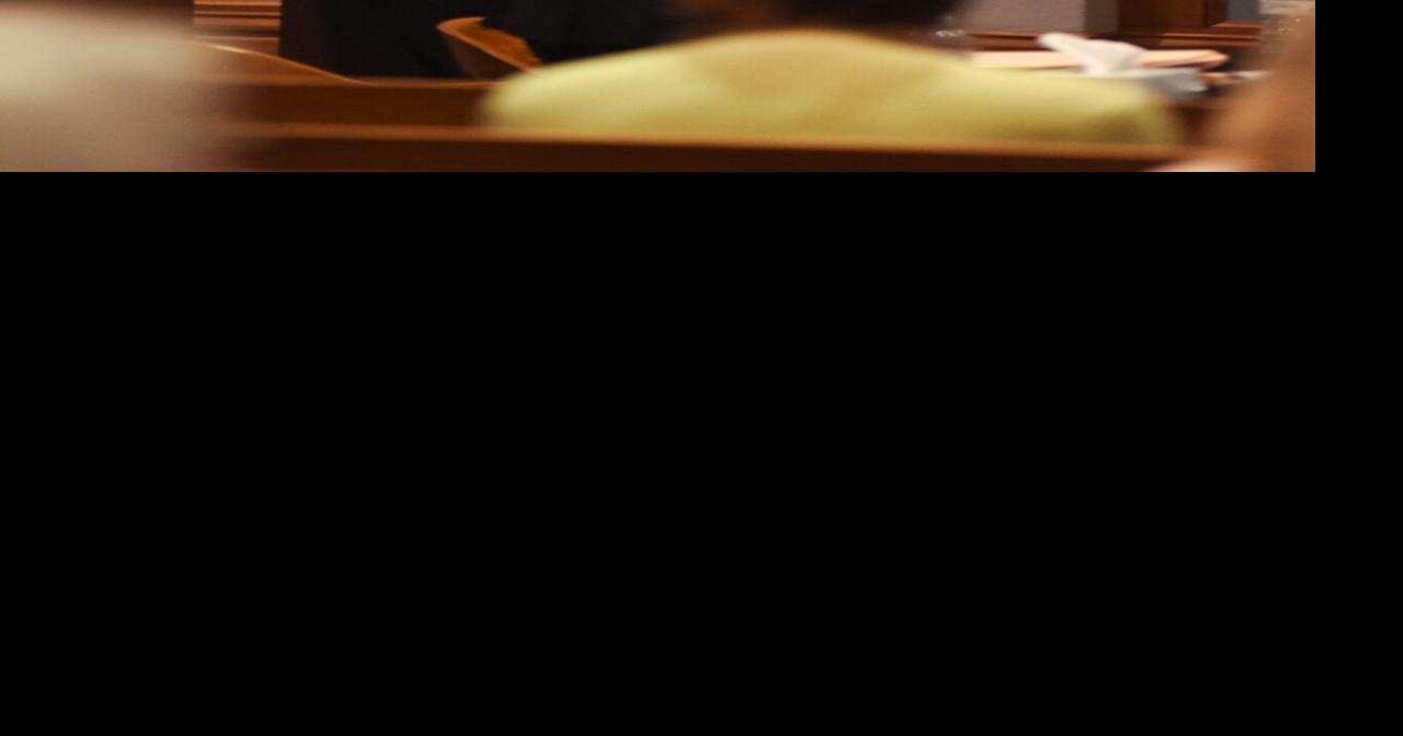 Defense attorneys Tim Hesemann and Katherine Berger look to each other