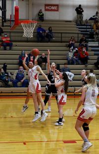 Harrisburg sophomore Carli Ellis catches a rebound