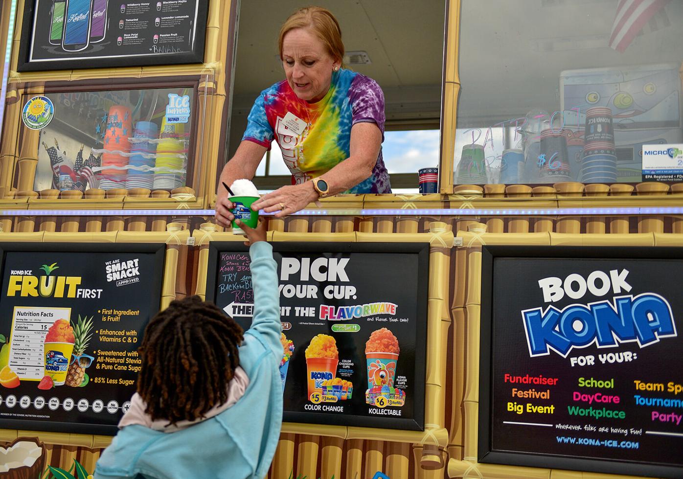Jeda Simmons, 7, grabs a snow cone