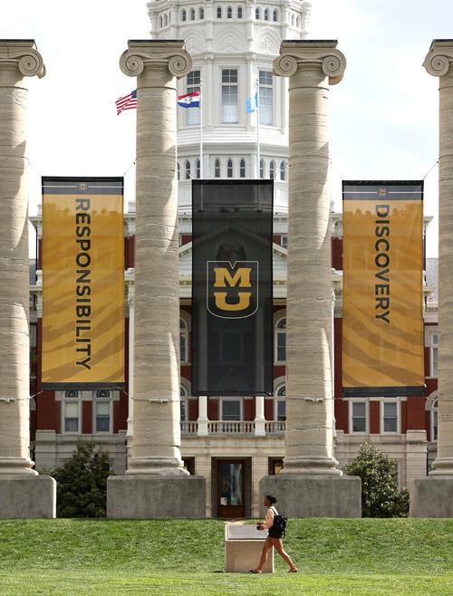 An MU student walks past the Columns