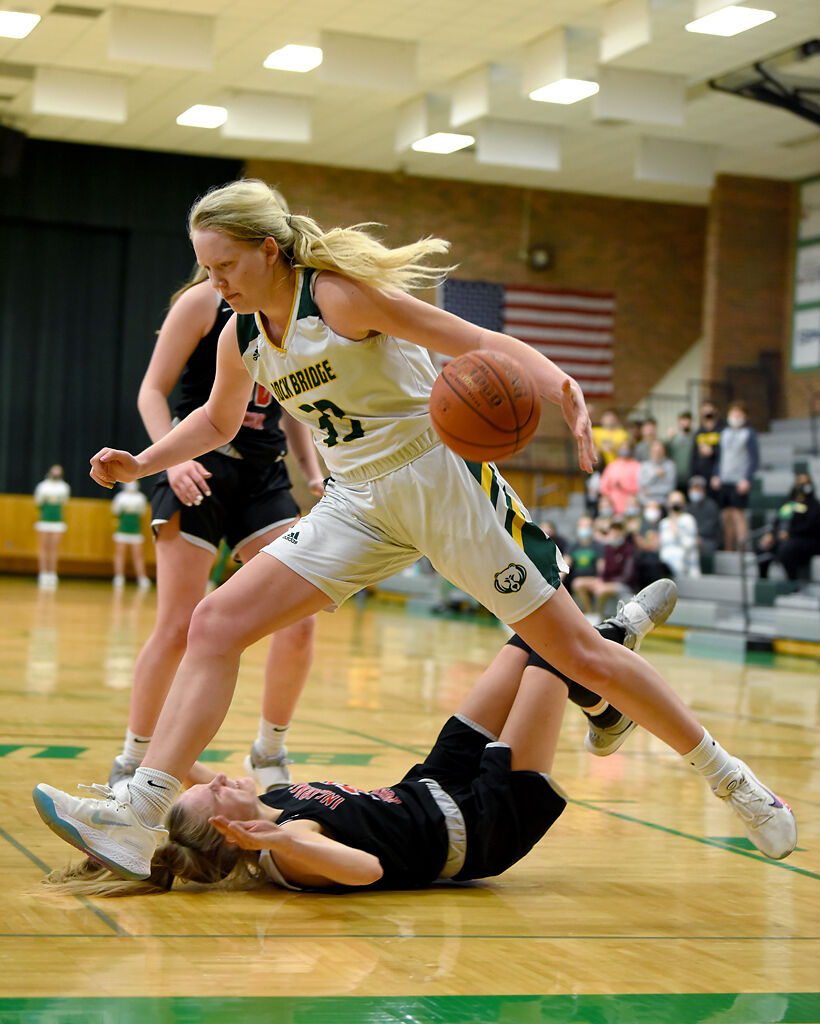 Rock Bridge forward Kyrah Brodie steps over Incarnate Word s