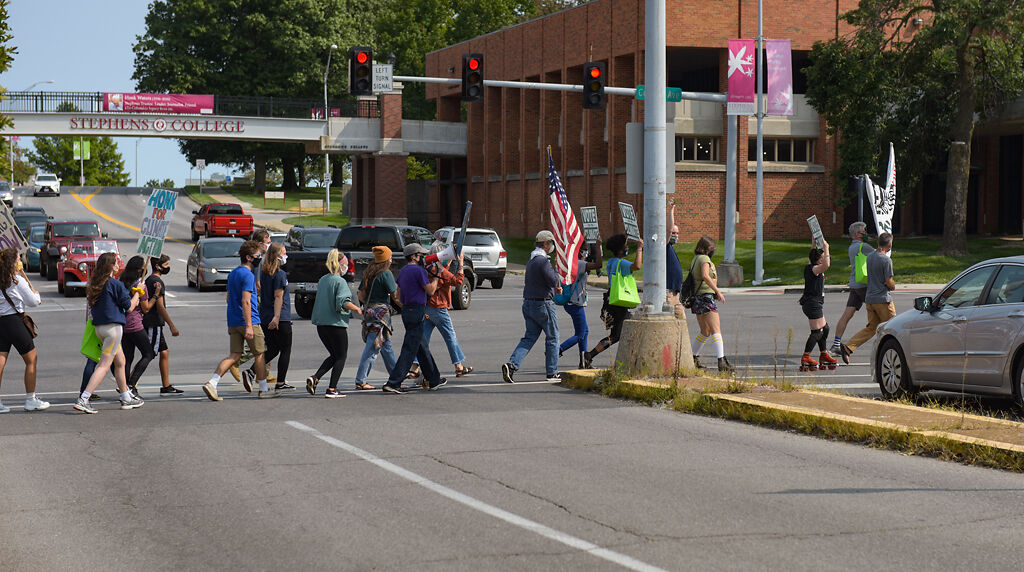 columbiamissourian.com - Kit Wiberg/Missourian - Environmental activists cross Broadway