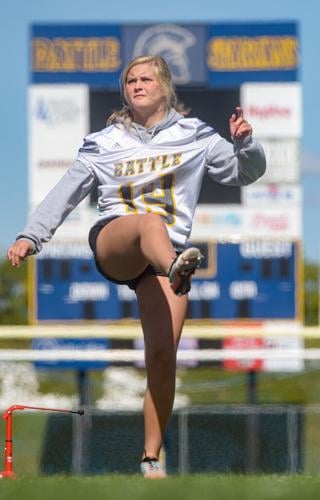 Sam Schupp kicks a football