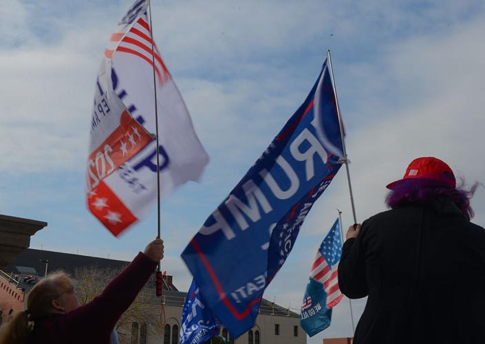President Donald Trump supporters wave flags during a rally in support of Trump