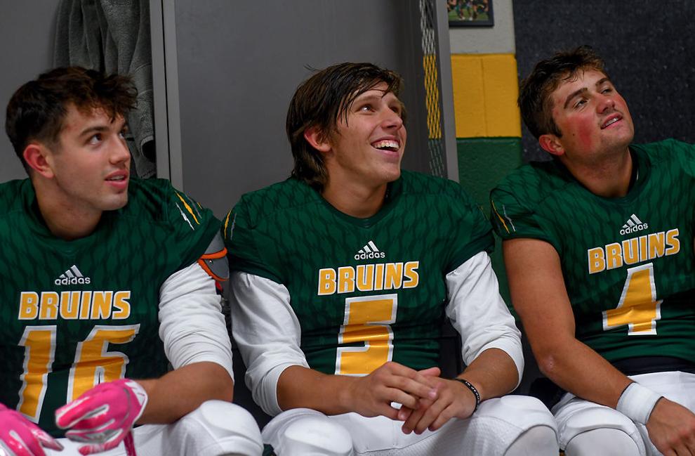 Rock Bridge football players Brant Bowers, Spencer Nivens, and Brett