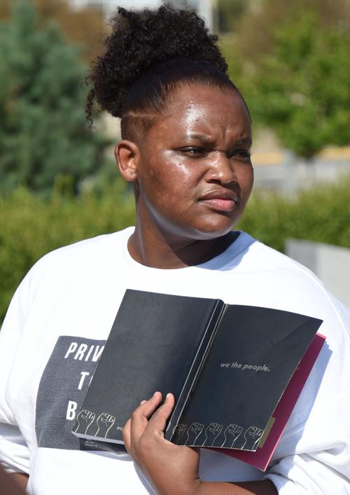 Kiessence Bassett, co-chair of the organization: 4 front, speaks at the beginning of the Solidarity Walk of The Legion of Black Collegians (copy)