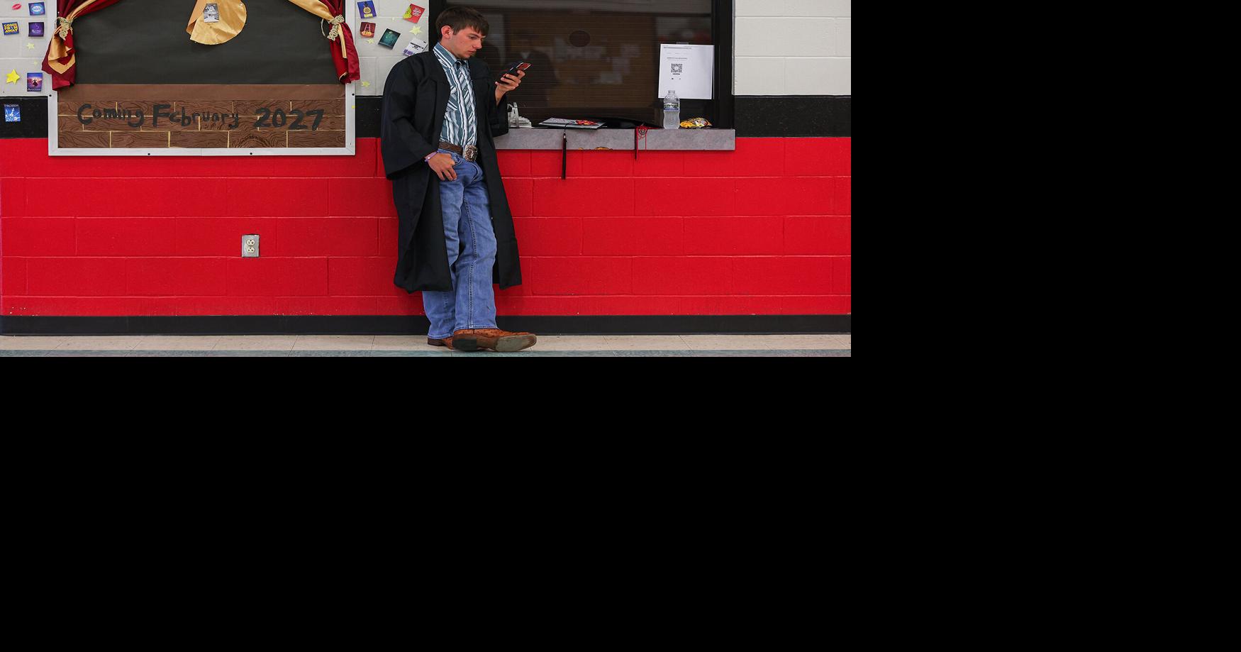 Alex Sachs waits in the gym before graduation