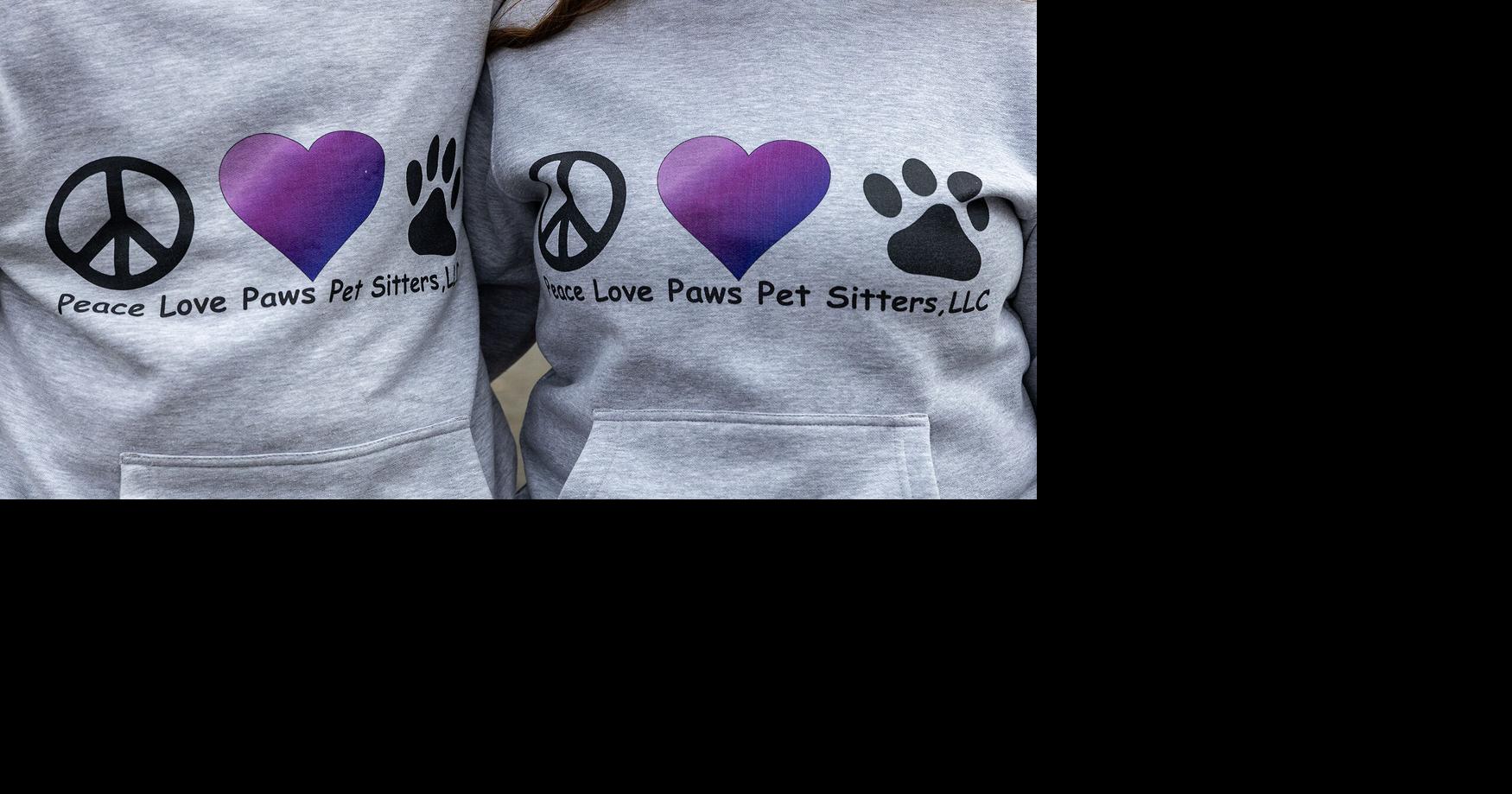 Scott and Bobbi Wilson, owners of Peace Love Paws Pet Sitters, sport