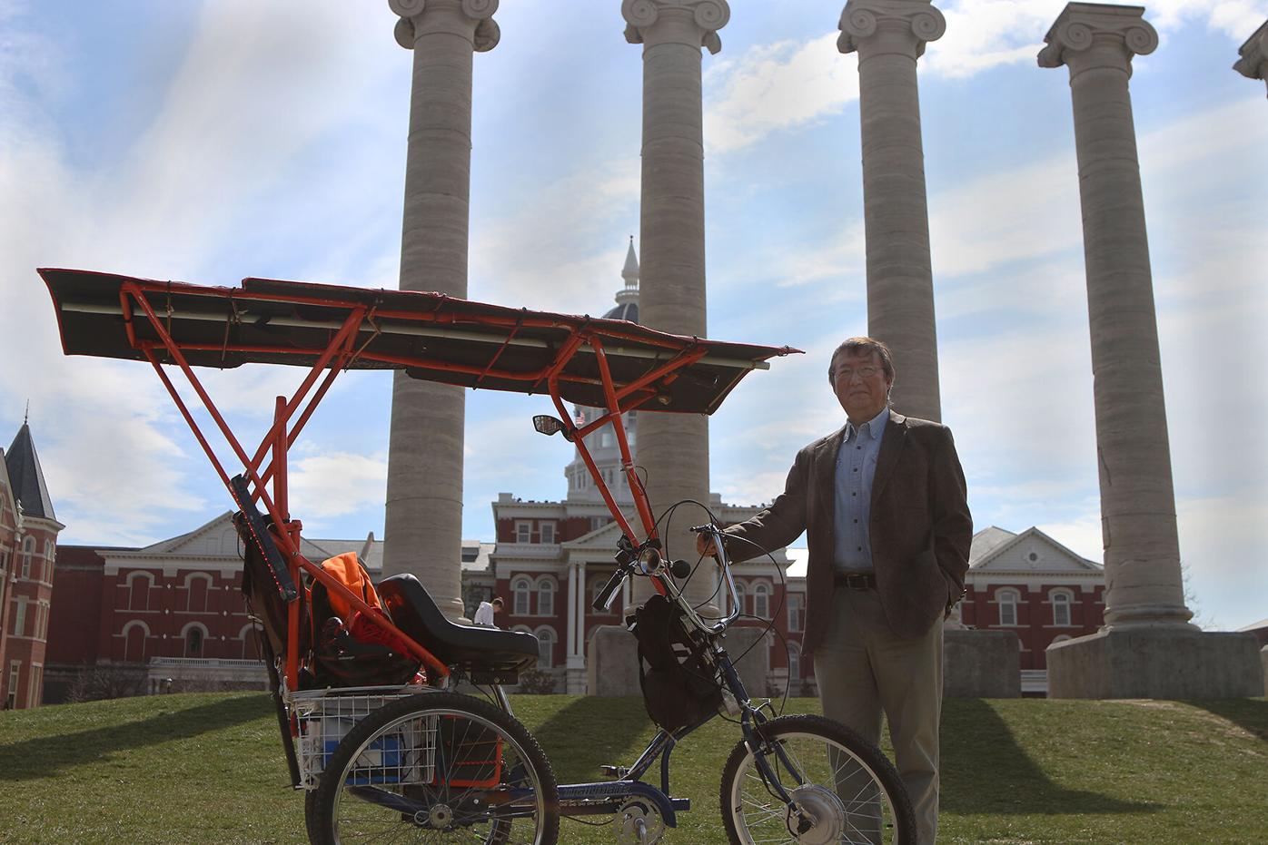 Bin Wu stands with his solar-powered tricycle | News |  columbiamissourian.com