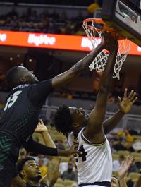 Kobe Brown Attempts To Score During The Mu Men S Basketball Game
