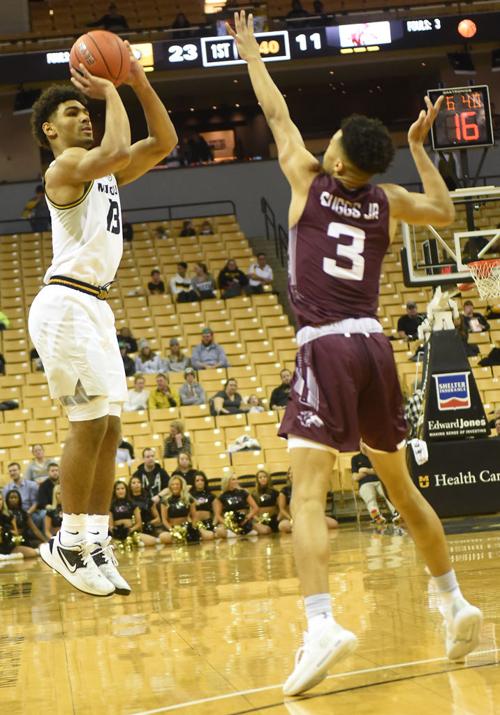 Missouri guard Mark Smith shoots a three-pointer