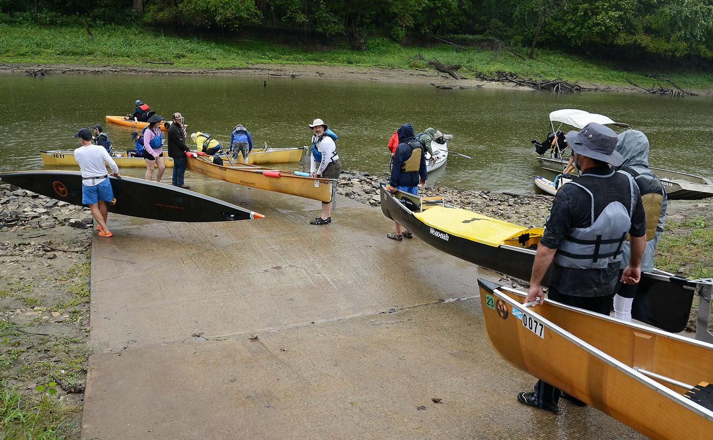 Kayakers launch themselves from the Providence access to Perche Creek