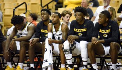 Missouri players sit on the bench
