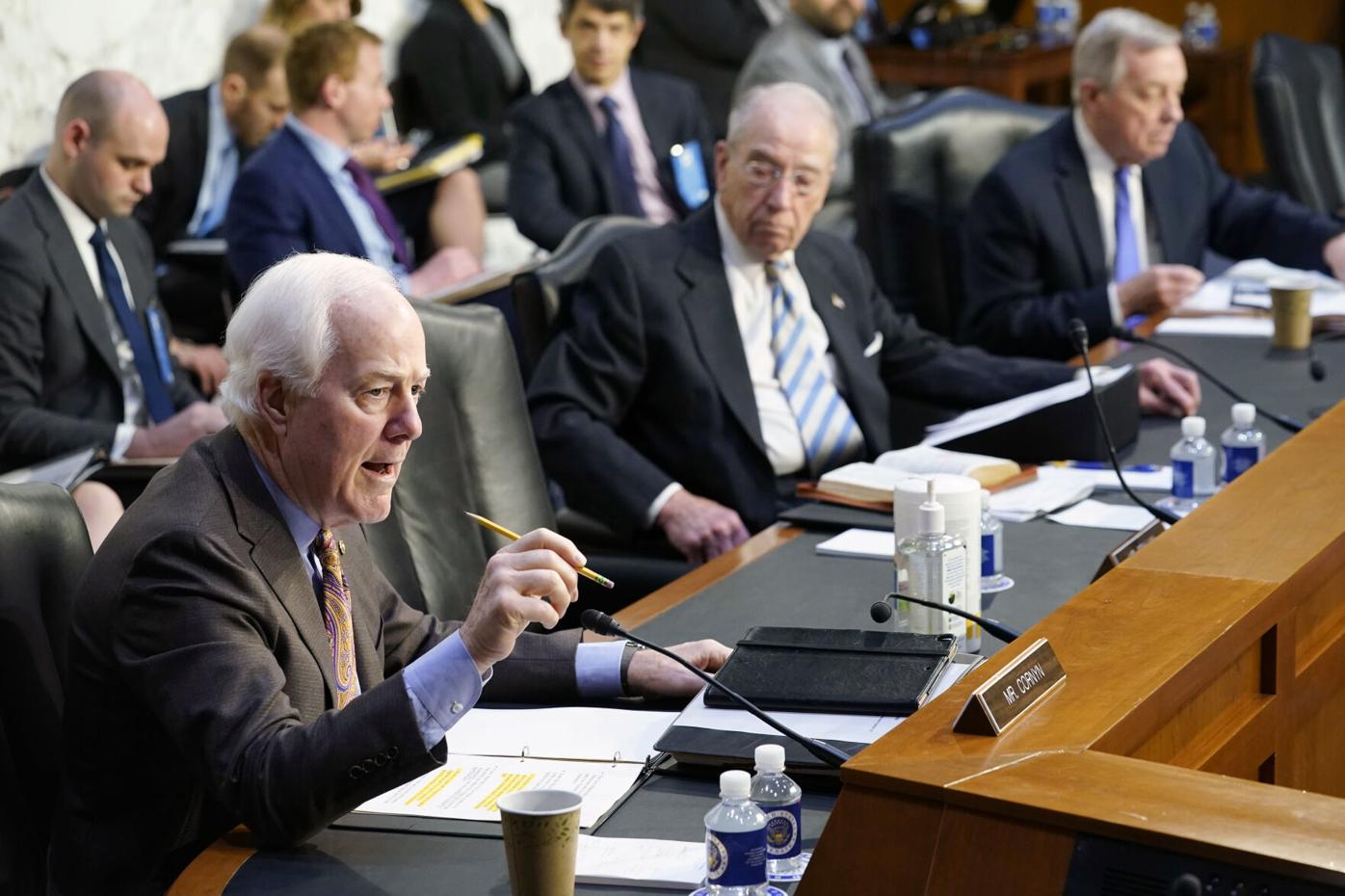 Sen. John Cornyn, R-Texas, left, speaks during the Senate ...