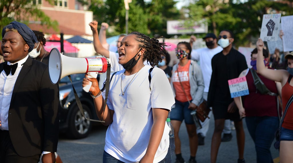 Protesters march from MU’s Francis Quadrangle to the Boone County Courthouse amphitheater on Sunday