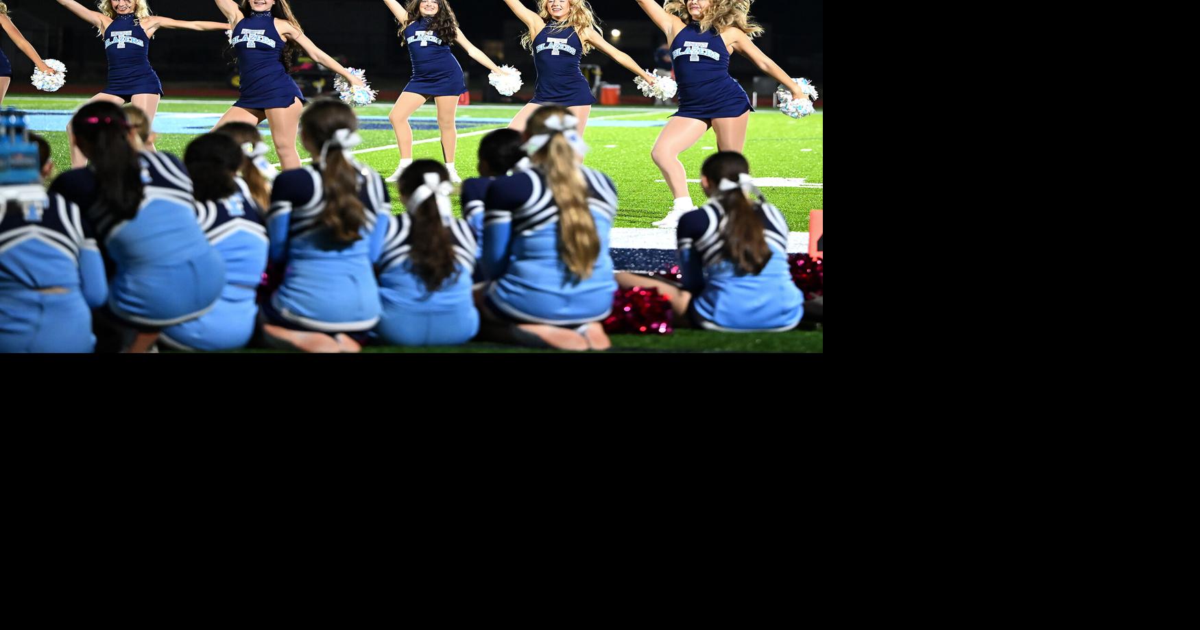 The Tolton cheer team watches the dance team’s halftime performance