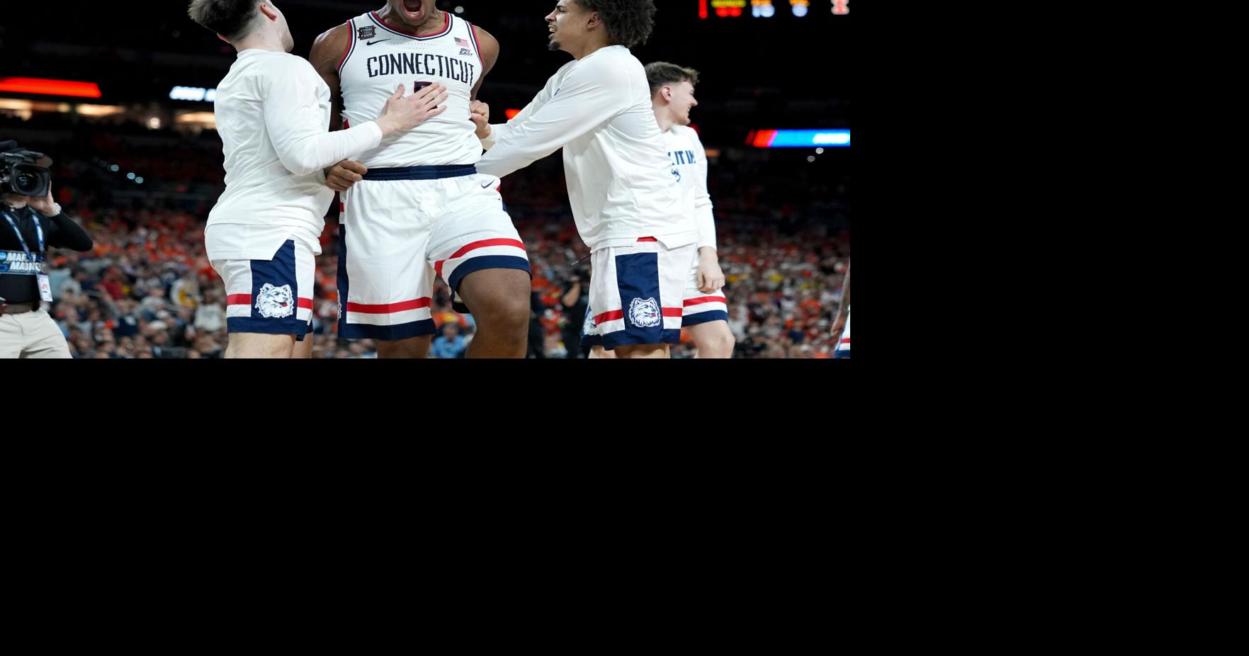 UConn downs Illinois, Michigan cruises past Arizona to advance to title game