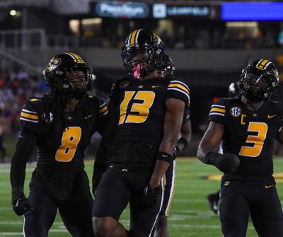 Daylan Carnell, center, celebrates a big play with the rest of the Missouri defense (copy)